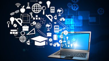 Zdjęcie laptopa, z którego wyłaniają się kształty geometryczne